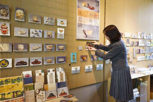 Mamiko Arakawa stocks postcards for a new exhibition at the Nezu Art Museum
