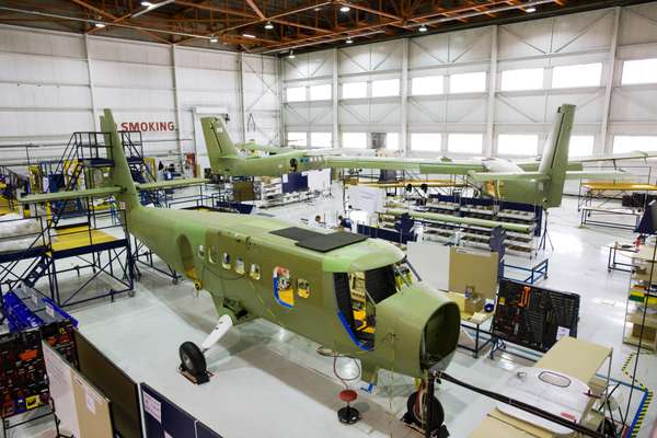 Three Twin Otters in various stages of assembly in the Calgary hangar