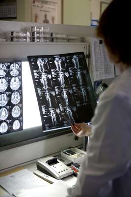 A doctor at Berlin’s Meoclinic examines tomography images
