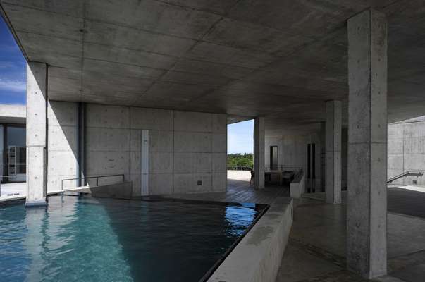 Swimming pool set at an angle to the surrounding walls