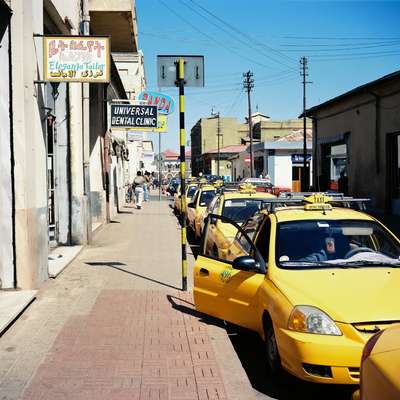 Taxis wait near a popular Italian restaurant