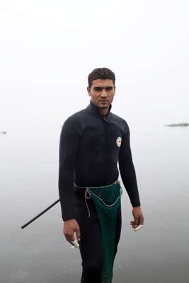 Ismailia resident out for early-morning clam collecting