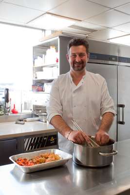 Chef Emmanuel Lejeune prepares lunch for the chief editors