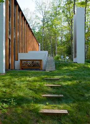 House to left and fireplace and path to lake on right 