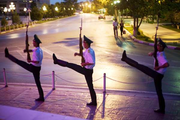 Soldiers march under the Arch of Neutrality in Ashgabat’s central square