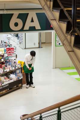 Staff greet customers as the store opens