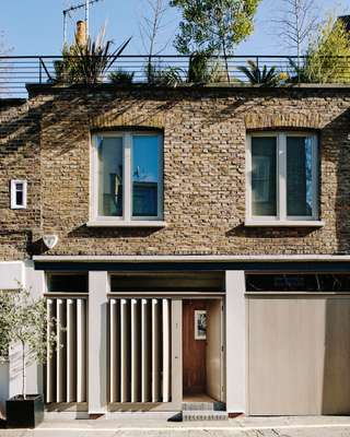 Series of oak fins that can be opened to allow in light but maintain privacy
