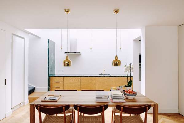 Oak panels were used on the kitchen cupboards along with a green marble slab
