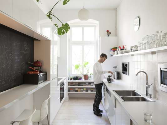 Emmy Skensved’s partner Greg Blunt in their apartment