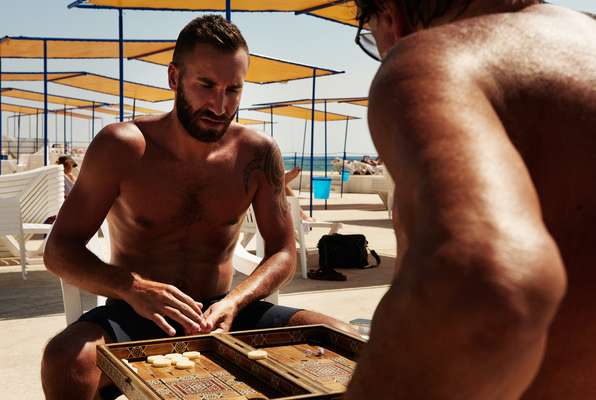 Maher Temseh mulling his next move in a game of backgammon 