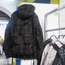A backpack integrated into a coat at the M stand