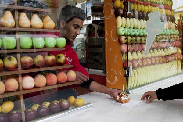 A waiter serves ice-cream