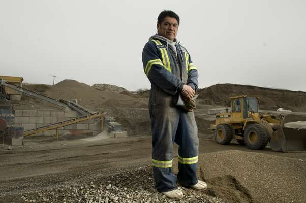 Worker Louis Baptiste in the gravel pit at the Oliver Readi-Mix site, British Columbia, an Osoyoos project