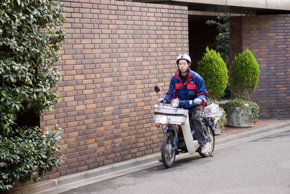 Newspaper delivery man