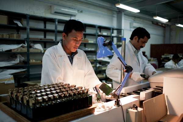 Workers at the Amouage bottling plant. The Omani perfume is one of the country’s best-known exports