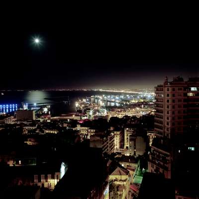 Night lights of Algiers with new construction in the suburbs