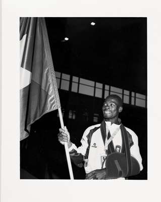 Guinea Bissau athlete proudly carries his flag
