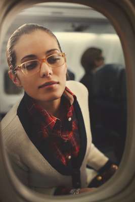 Glasses by Persol, cardigan by Macphee, shirt dress by Muji, bracelets by Hermès, watch by Cartier