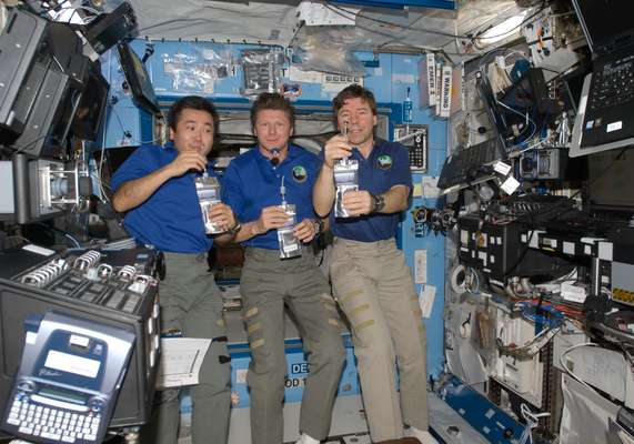 Wakata with fellow astronauts aboard the International Space Station