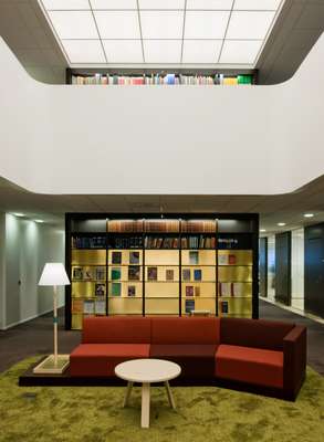 The library, featuring a back-lit glass ceiling and bespoke furniture by Martin-Löf