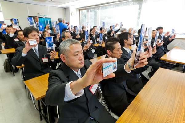 Drivers with their licences and Nihon Kotsu company manuals