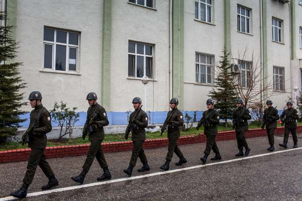 Turkish military police line up for defence minister Ismet Yilmaz