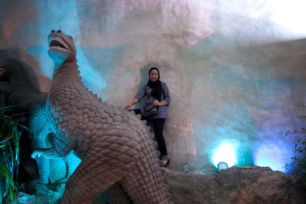 Tourist and one of the residents at the Kish Dolphin Park