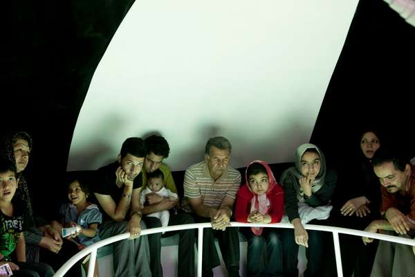 Family from the landlocked city of Mashhad take a trip in a glass-bottomed boat.