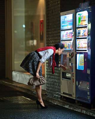 Shirt by Yaeca, jumper by John Smedley, skirt and shoes by Dior, watch by Dior, bag by Gucci