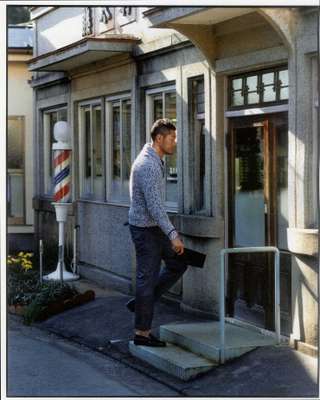 Jumper by Bally, polo shirt by Moncler, trousers by Engineered Garments, pouch by Porter, shoes by Prada 