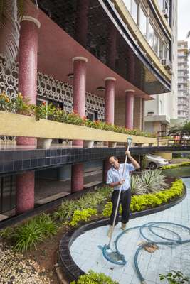 Employee cleans the shallow entrance pool