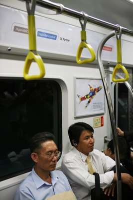 South Korean commuters inside a Line 9 subway car 