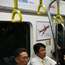 South Korean commuters inside a Line 9 subway car 