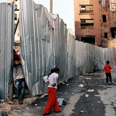 Playing among demolished houses