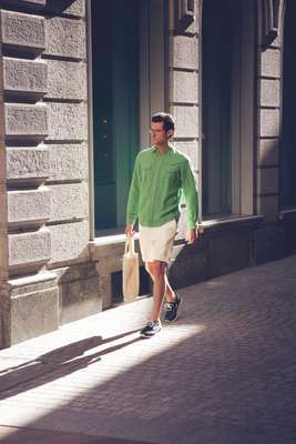 Glasses by Oliver Peoples, shirt by Polo Ralph Lauren, shorts and shoes by Louis Vuitton, bag by Barena