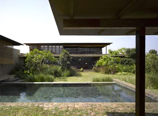 The pool is surrounded by greenery