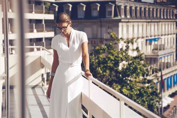 Glasses by Prada, dress by Ralph Lauren, watch by Gucci, bracelet by Hermès