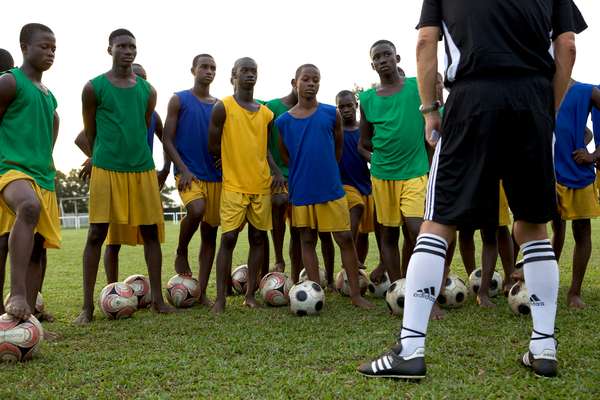 Students listen intently to their coach