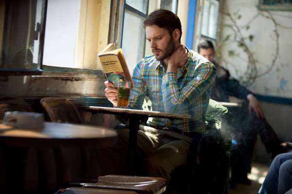 Shirt by Glanshirt,  belt by Oliver Spencer, trousers by Post O’alls, jacket (on chair) by Moncler