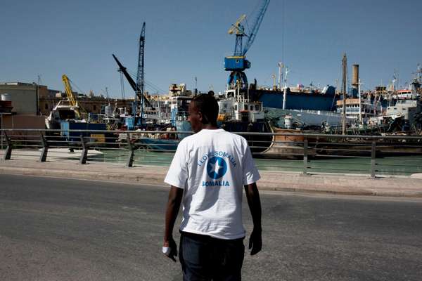 Man outside the centre for migrants at Marsa