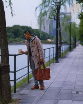 Duffle coat by  Grenfell from Beams F, tank top by United Arrows, shirt by Orian for Beams, trousers G.T.A, bag & shoes by Visvim, gloves by Dunhill