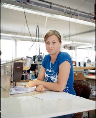 Seamstress sews a lining