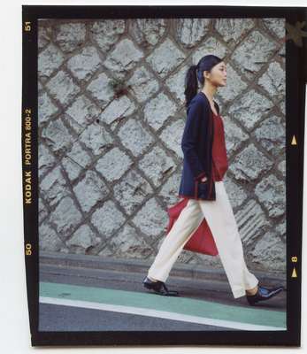 Cardigan, camisole and bag by Hermès, trousers by Chloé, coat by Tomorrowland Collection from Tomorrowland, shoes by Margaret Howell