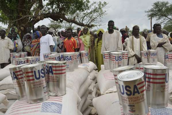 Refugees line up for food distribution at the Batil camp