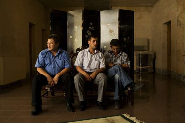 Men in the lobby of Hotel Aziya 
