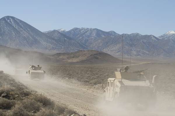 Marine convoy heads towards the mock village in the Nevada mountains