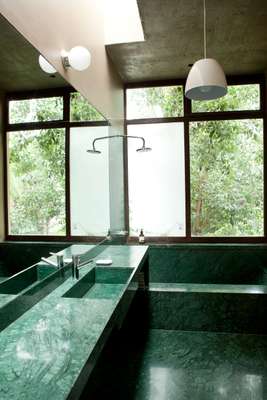 Modernist ensuite bathroom linking to the master bedroom