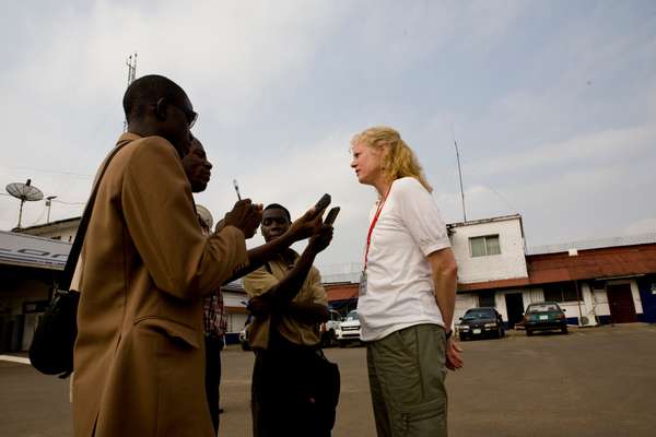 Peg Halloran, a TSA official, talks with local journalists at the airport