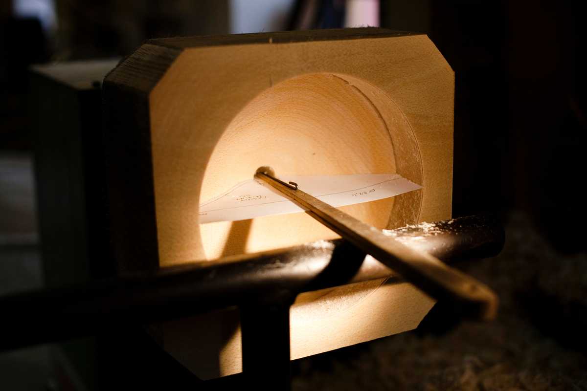 Wooden moulds are made to the exact measurements of the intended shape of the glass pieces