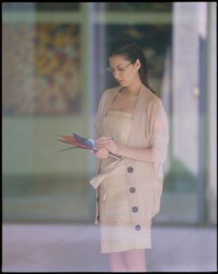 Dress by Bottega Veneta, cardigan by Zhor & Nema from International Gallery Beams, necklace & bracelet by Louis Vuitton, glasses by Alain Mikli